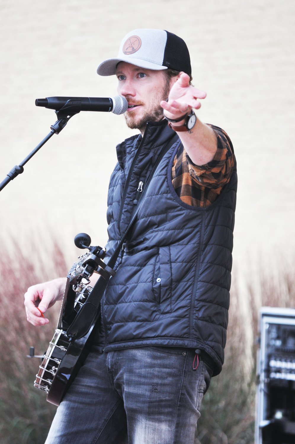 Singer Jerod Bolt talks in between songs during a performance at the Crawfordsville Farmers' Market Saturday. Bolt is a Southern Christian rock artist from northern Indiana.